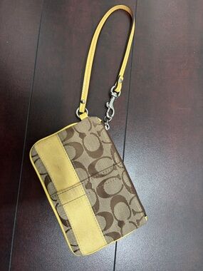 Coach Brown Signature Canvas Wristlet with Yellow Trim